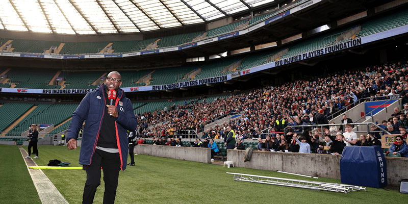 Ugo Monye commentating on the sidelines at Allianz Stadium in Twickenham